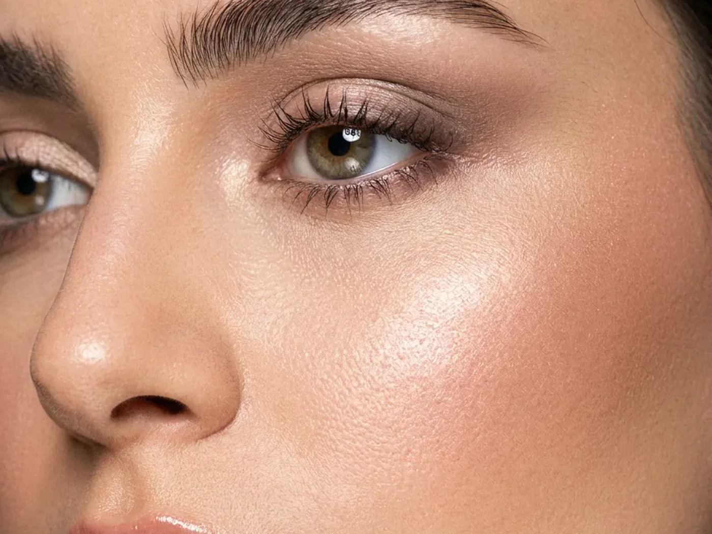 A close-up of a bride's flawless makeup, looking fresh and natural in the daylight hours after it was applied.